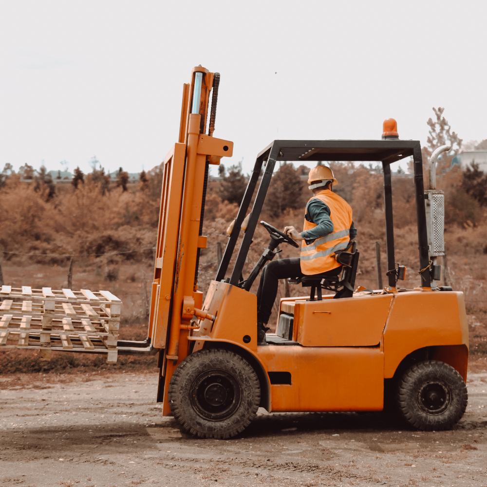Forklift operator in a supply yard